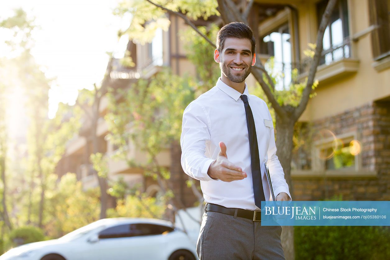 Confident Businessman Extending Hand For Handshake High Res Stock Photo