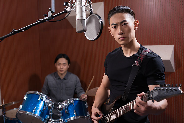 Chinese Musical Band In Recording Studio High Res Stock Photo For Download