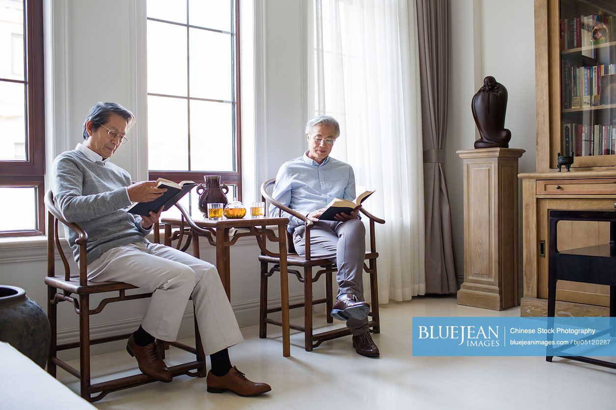 Senior Chinese men reading books