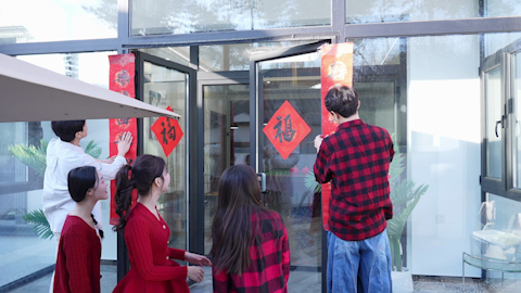 Young friends celebrating Chinese New Year together