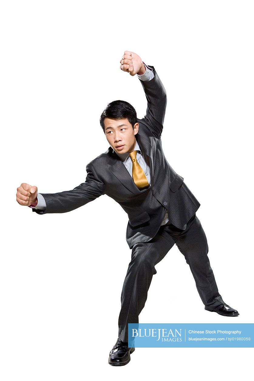 Chinese businessman waiting in fighting stance