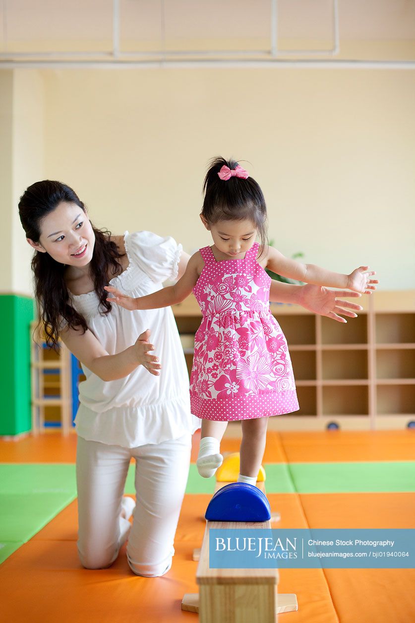 Chinese mother playing with daughter