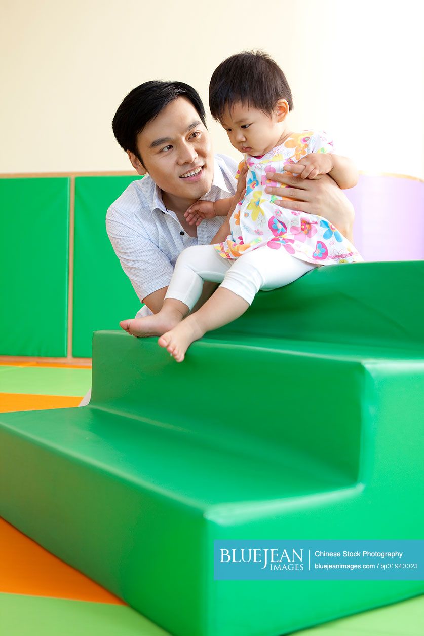 Chinese father playing with daughter