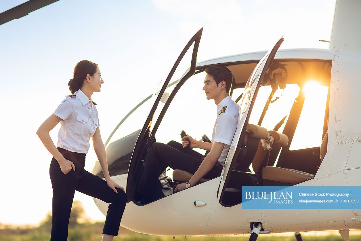 Cheerful Chinese helicopter pilots talking