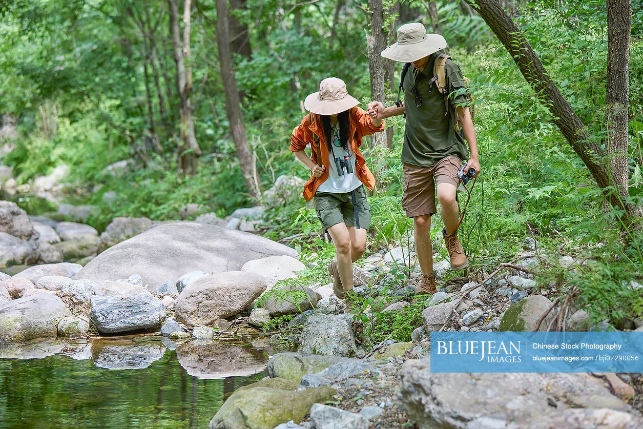 Happy man hiking through the serene beauty of nature