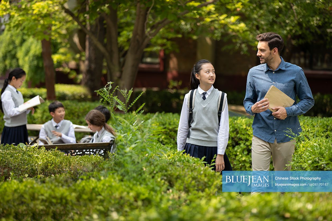 Teacher and students on campus
