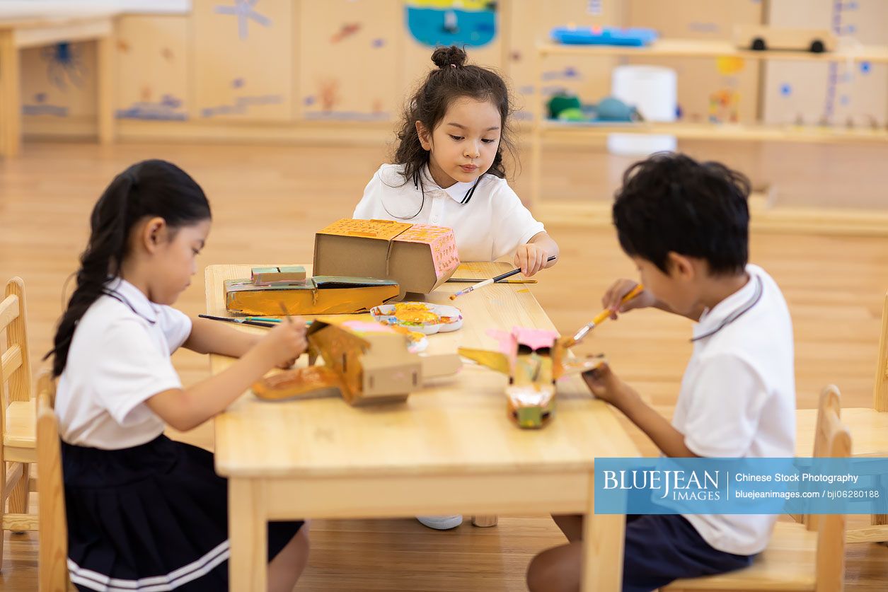 Children having art class in classroom