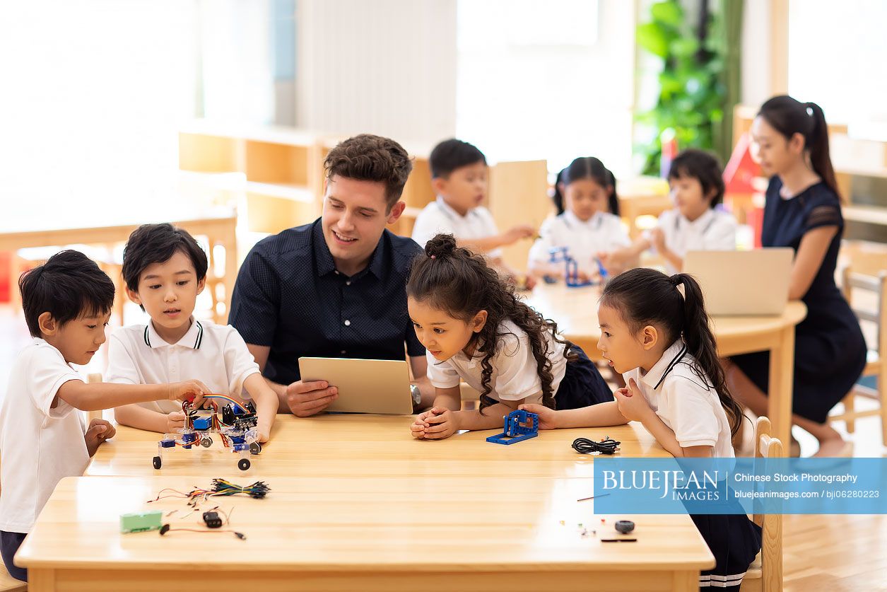 Children learning coding in classroom