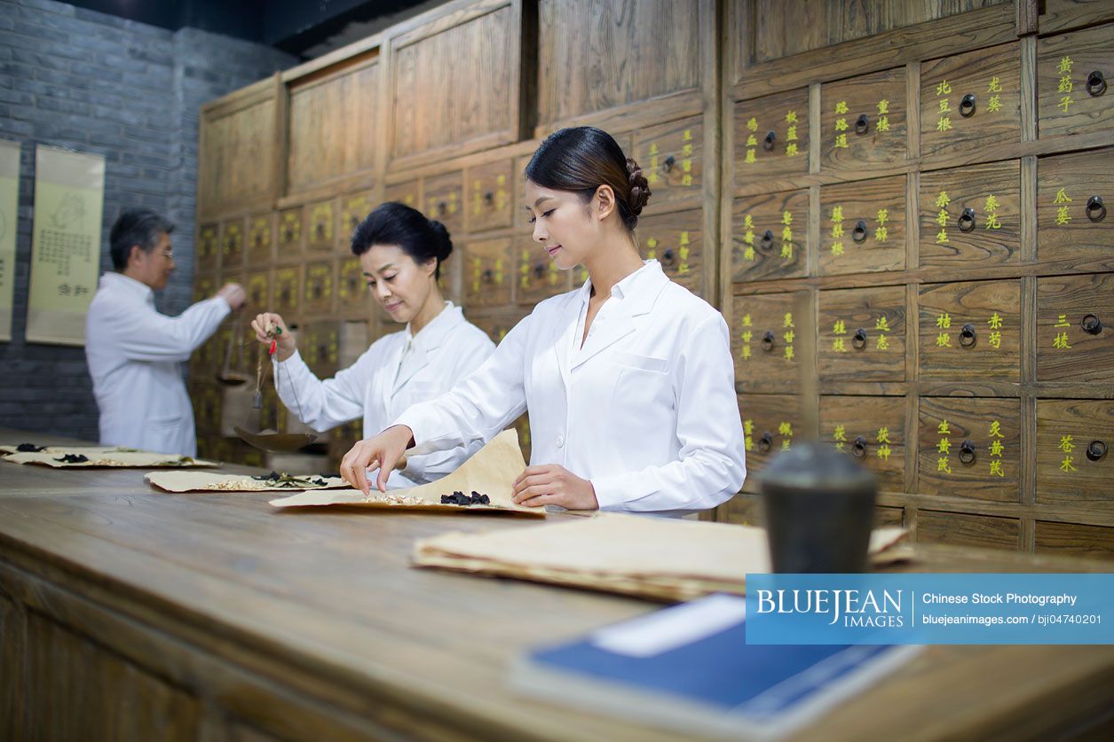 Chinese doctors in traditional Chinese medicine pharmacy