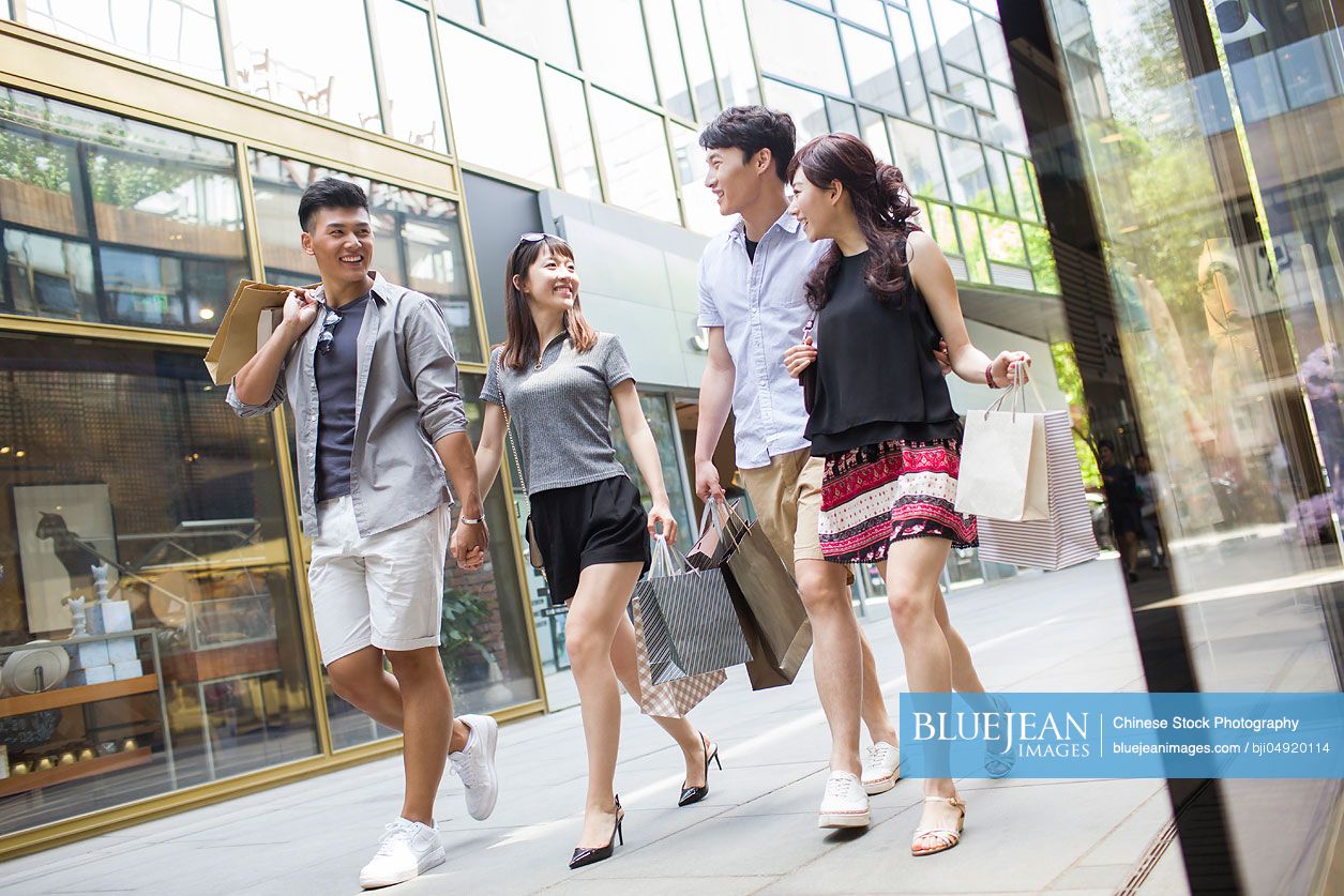 Happy Young Chinese Friends With Shopping Bags-High-res Stock Photo For ...