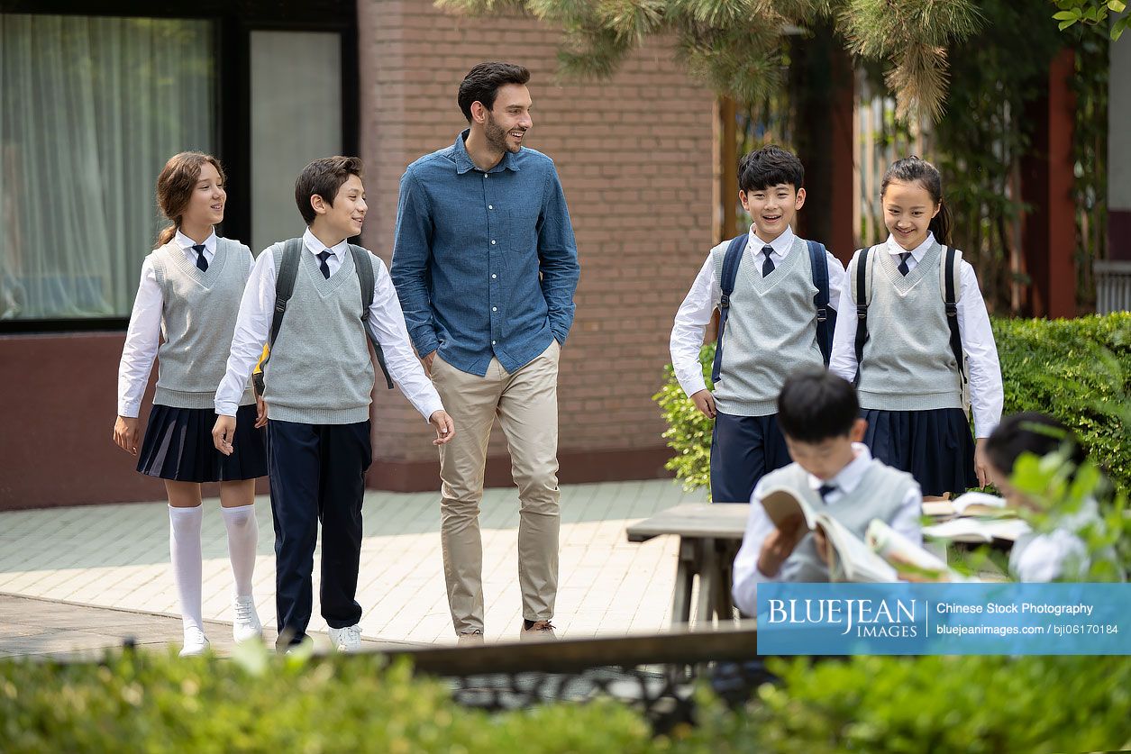 Teacher and students on campus