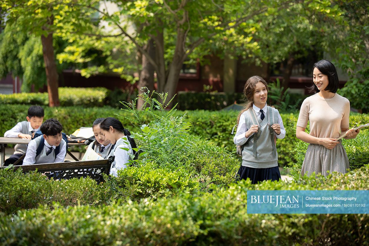 Teacher and students on campus