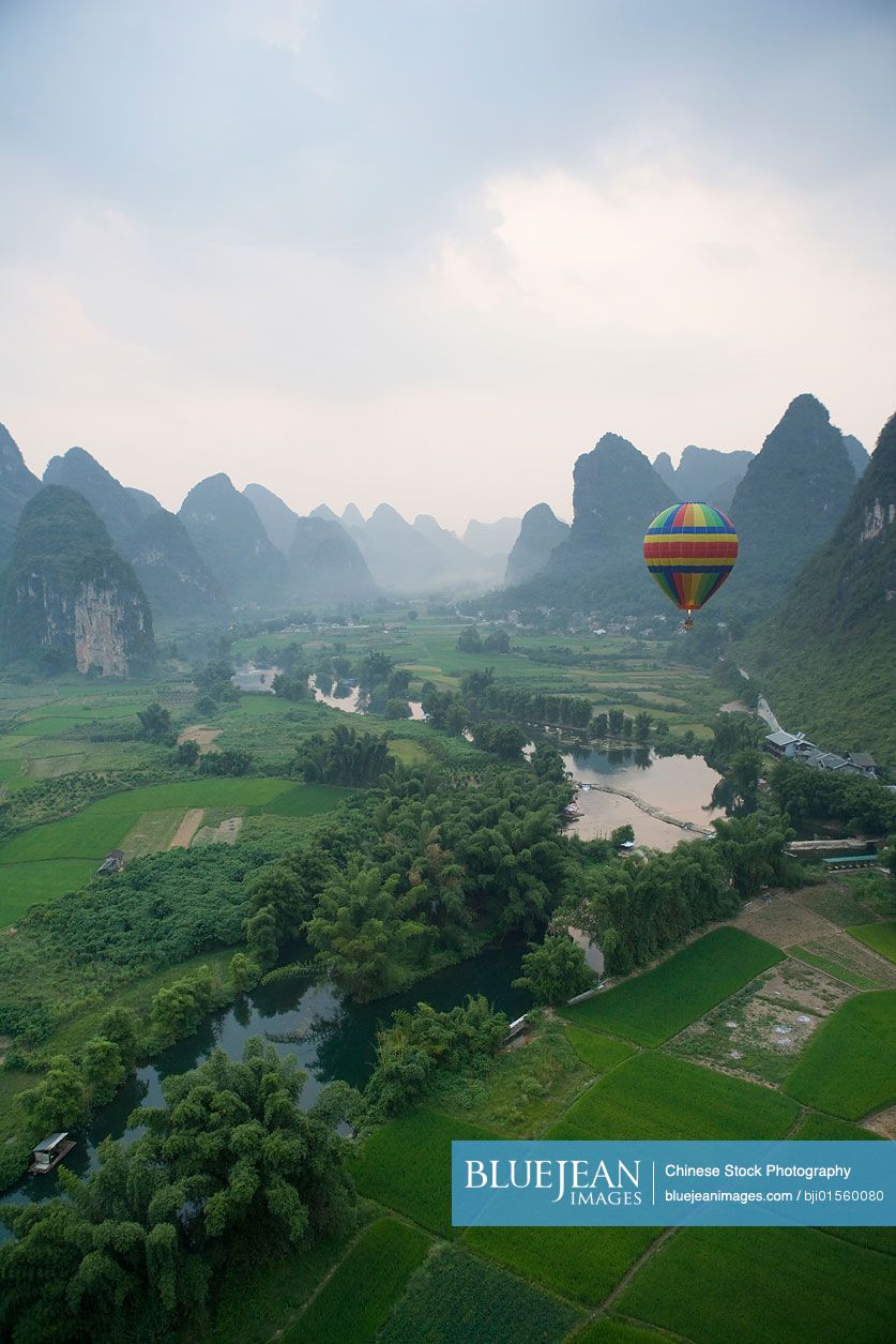 Hot air balloon flying above the Guilin Hills