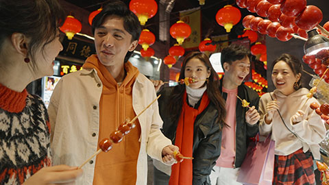 Young Chinese friends with candied haw celebrating Chinese New Year,4K