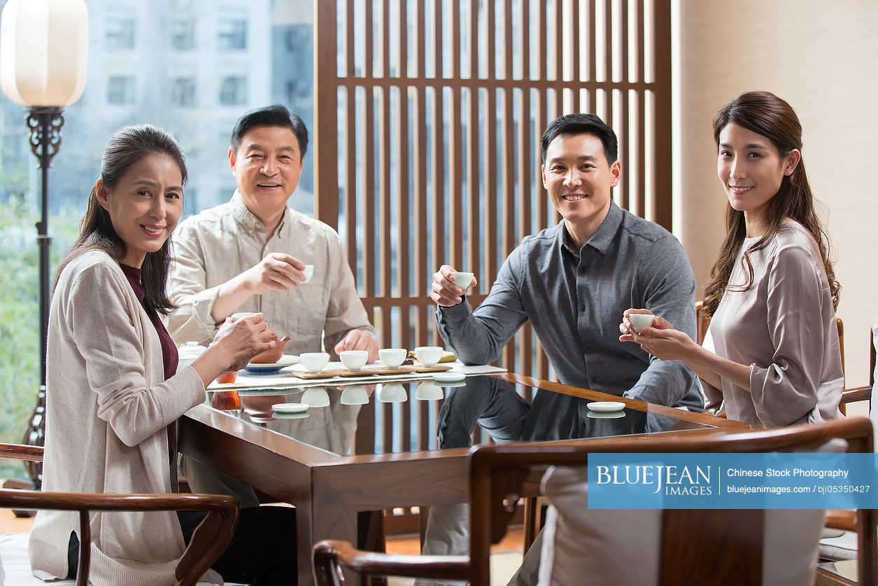 Chinese friends drinking tea together