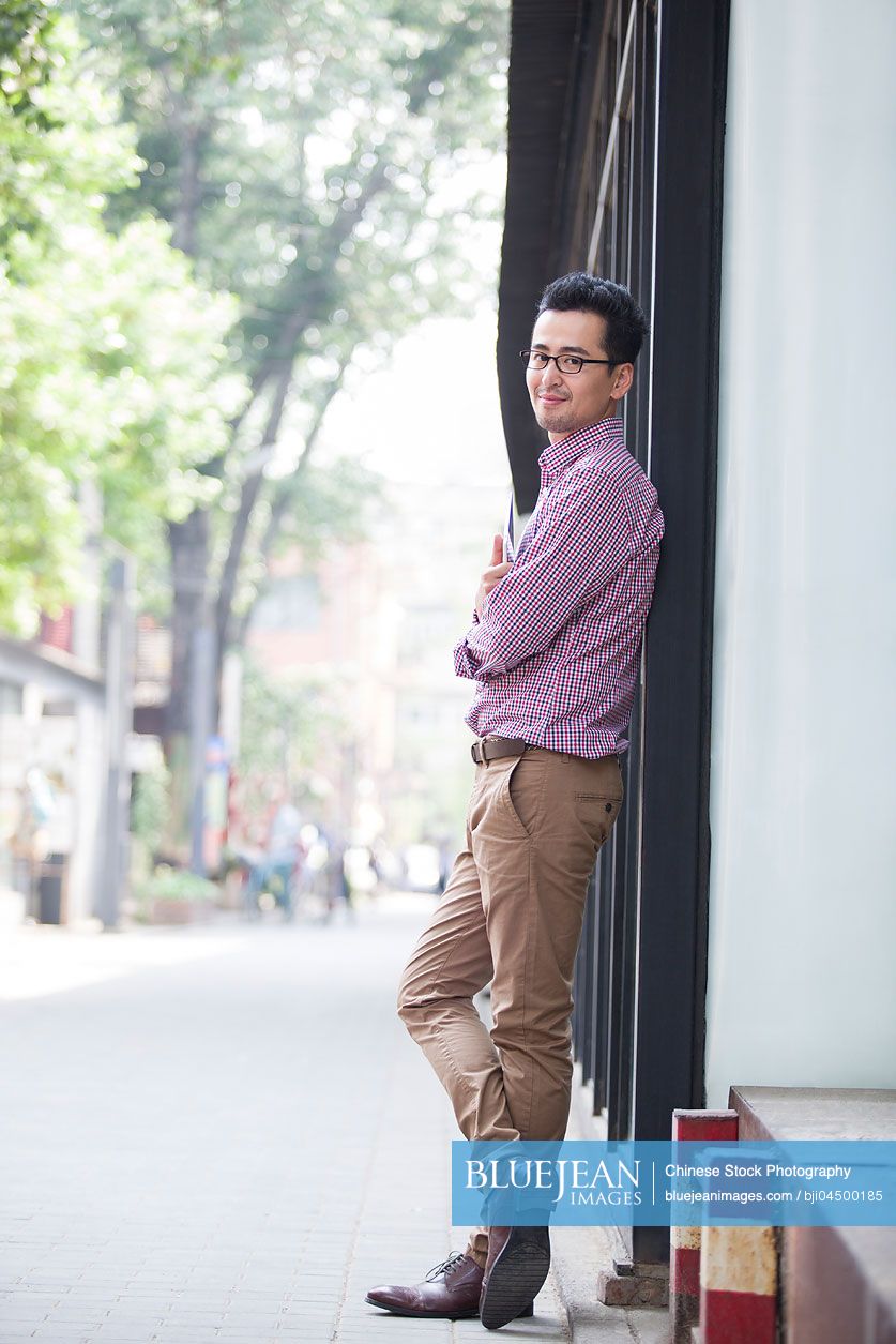 Happy mid adult Chinese man