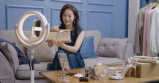 Female influencer live-streaming a product sale