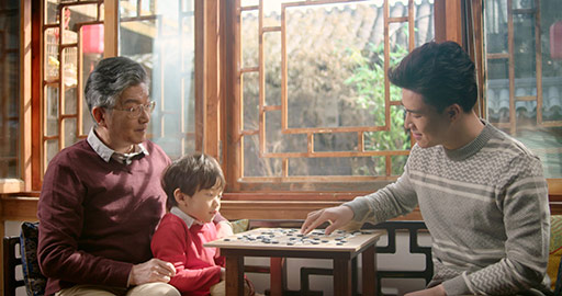 Happy Chinese family playing the game of go,4K