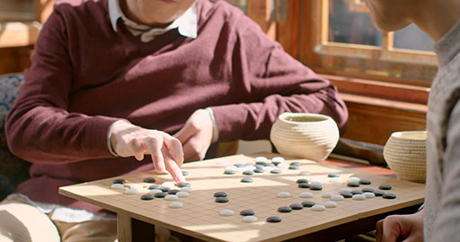 Happy Chinese father and son playing the game of go,4K