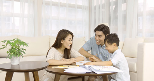 Young Chinese parents helping son with homework,4K