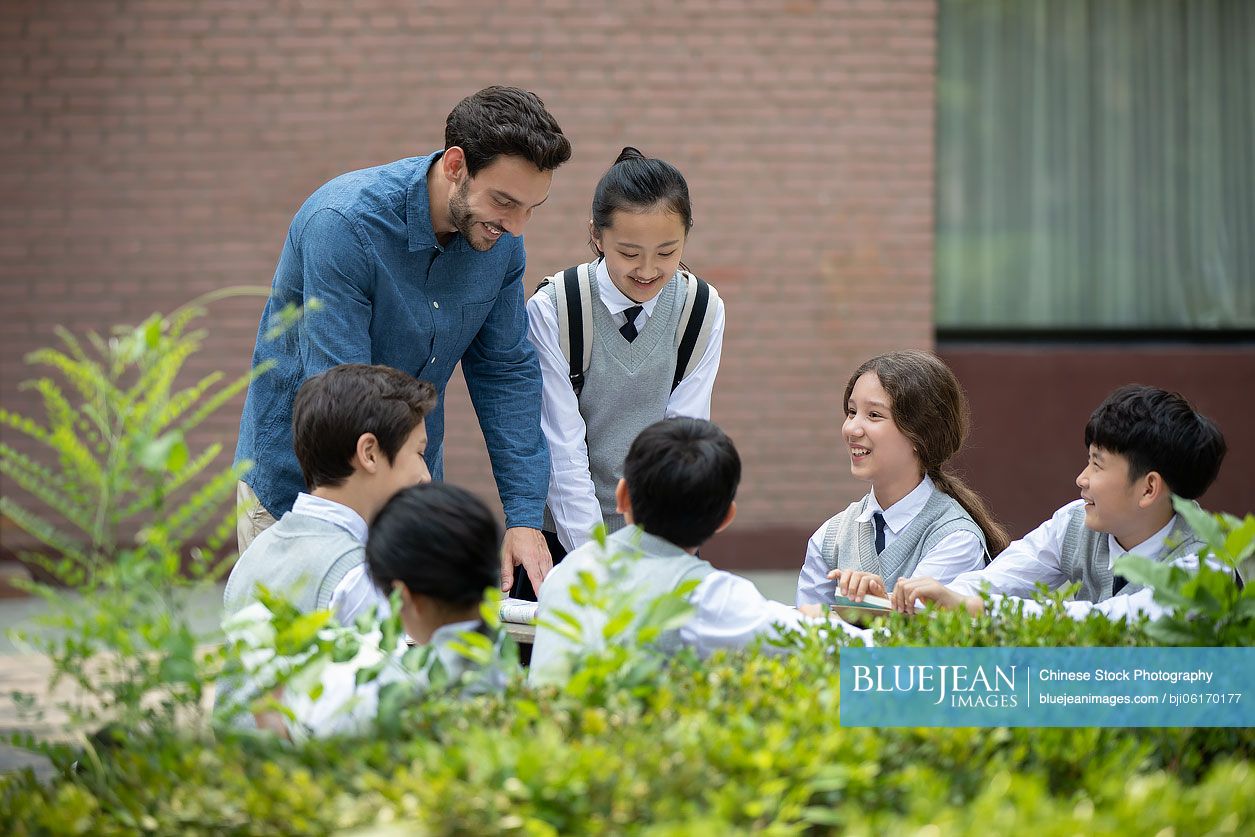 Teacher and students on campus