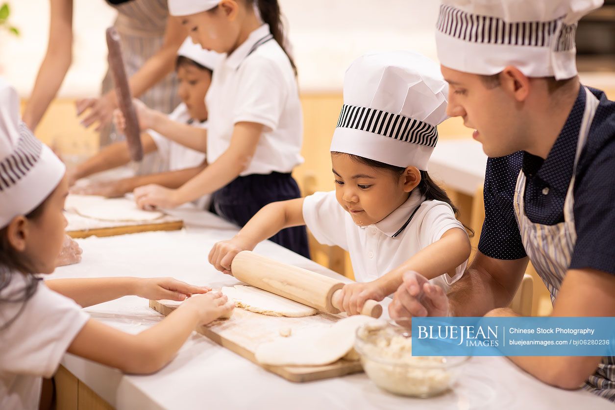 Children learning cooking in classroom
