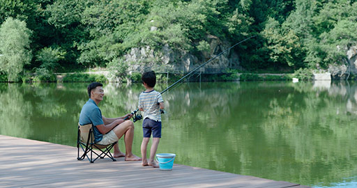 Chinese father and son fishing outdoors,4K