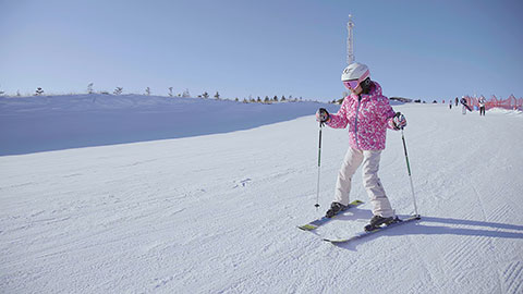Little Chinese girl skiing in ski resort,4K