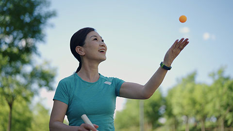 Chinese woman playing table tennis ball