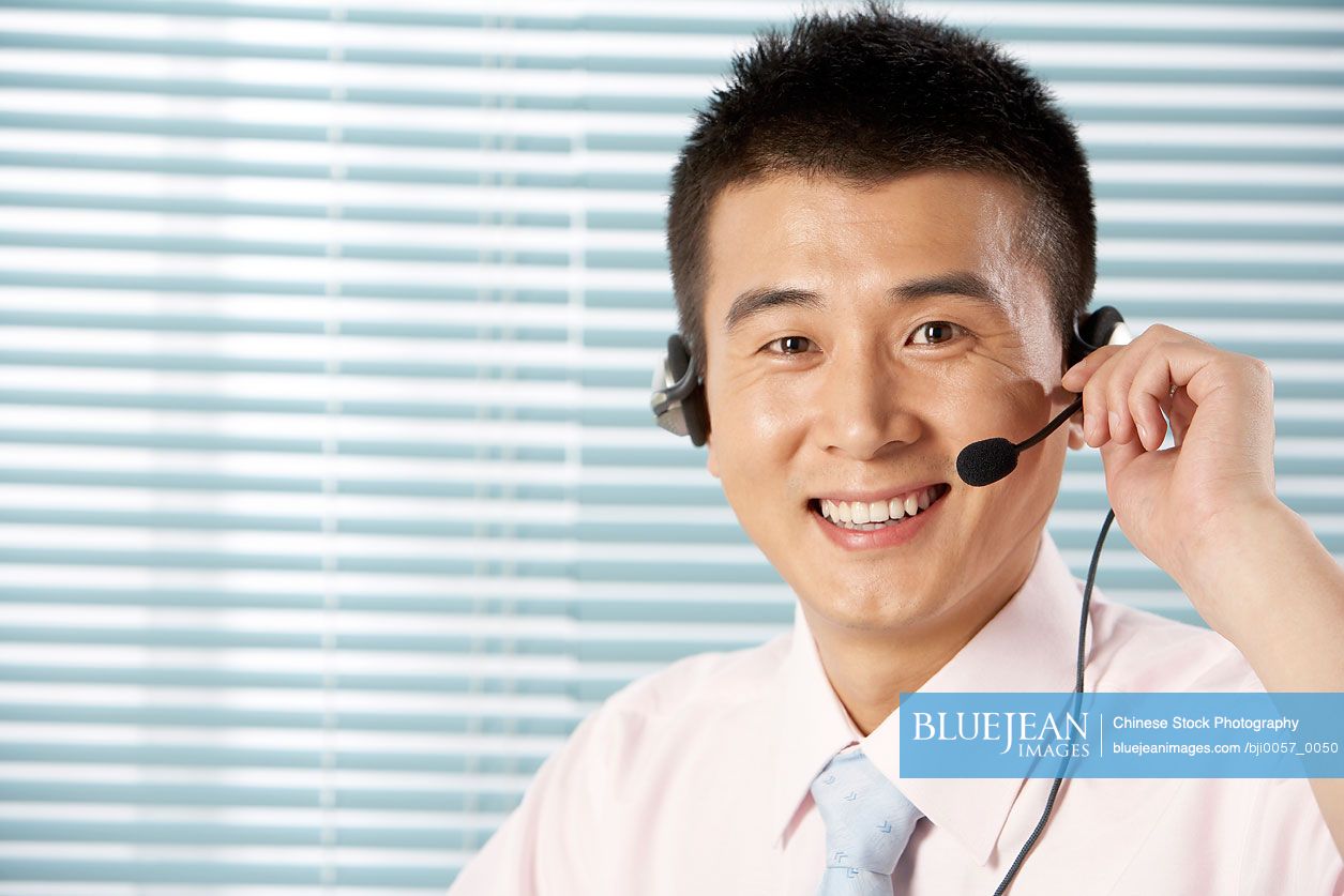 Chinese Man Wearing A Headset