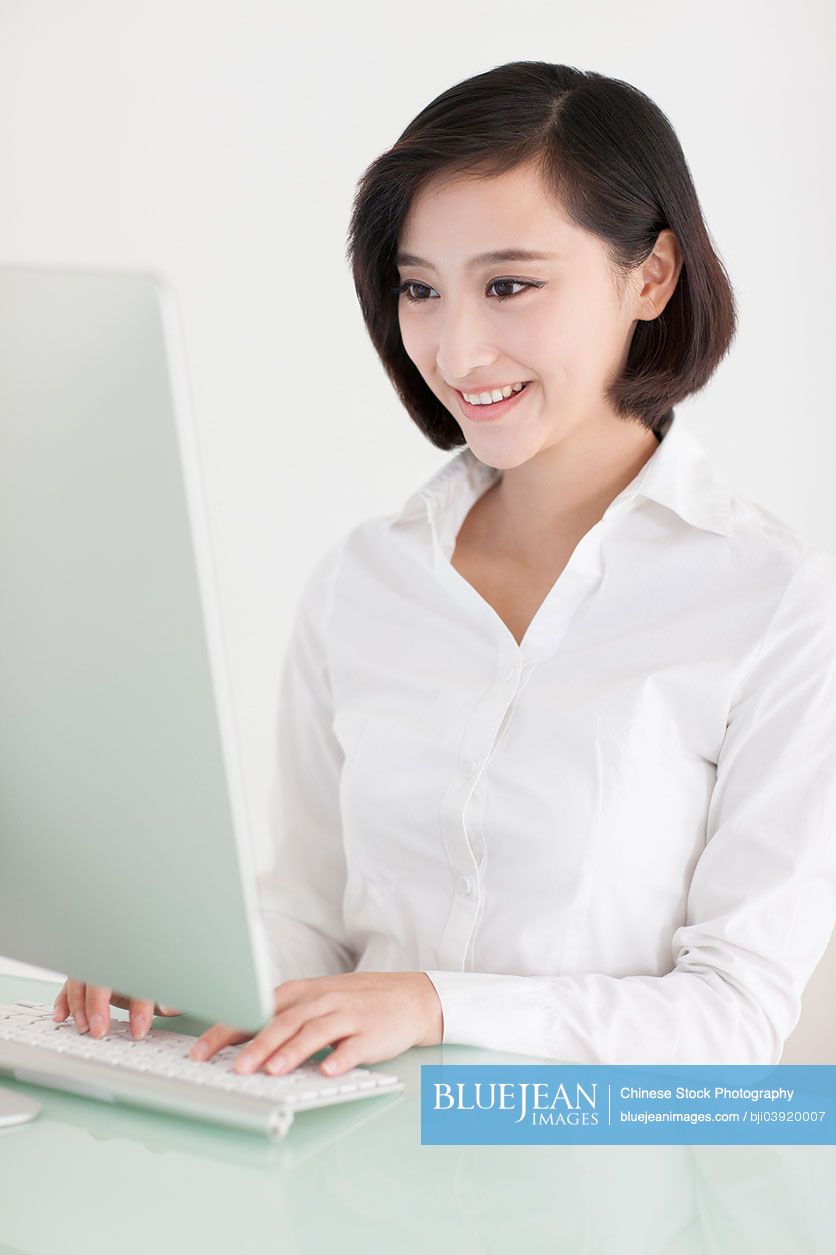 Young Chinese office lady at work-High-res stock photo for download