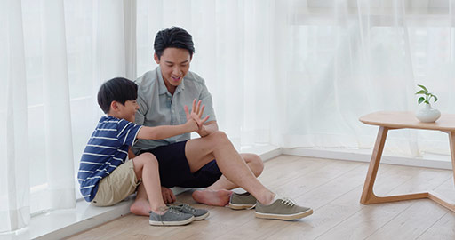 Chinese father and son sitting on floor,4K