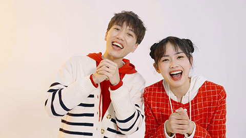 Happy young Chinese couple celebrating Chinese new year