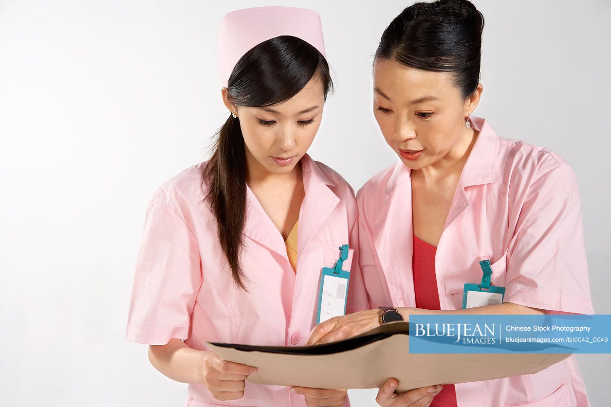 Chinese nurses with X-ray sheets