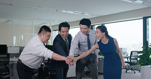 Chinese business people stacking hands in office,4K