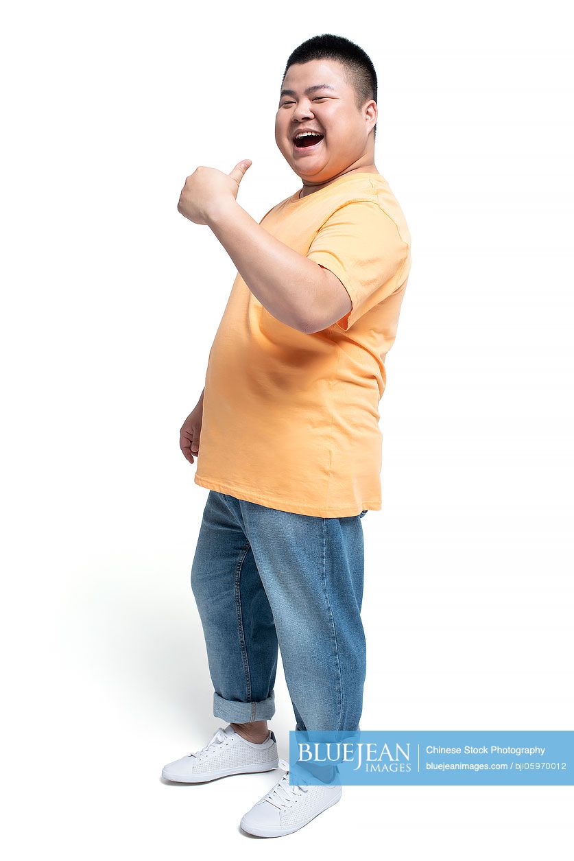Young Chinese man doing thumbs-up