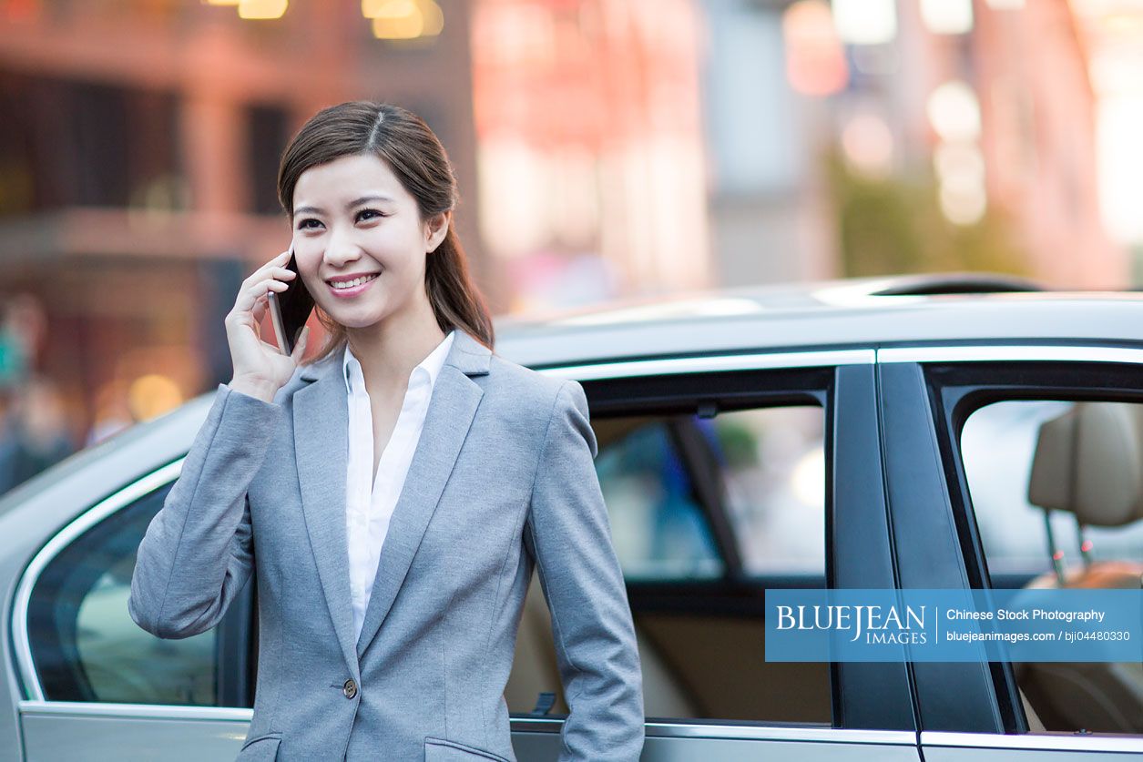 Young Chinese businesswoman talking on the phone