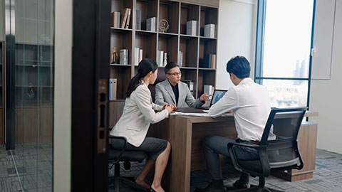 Confident Chinese business people having a meeting