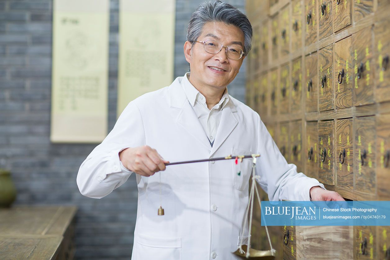 Senior Chinese doctor fill the prescription