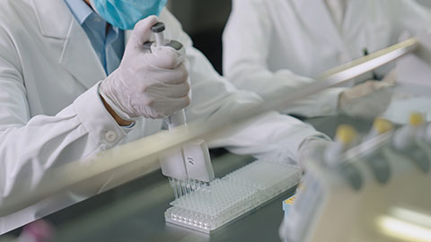 Chinese scientist pipetting samples in laboratory,4K