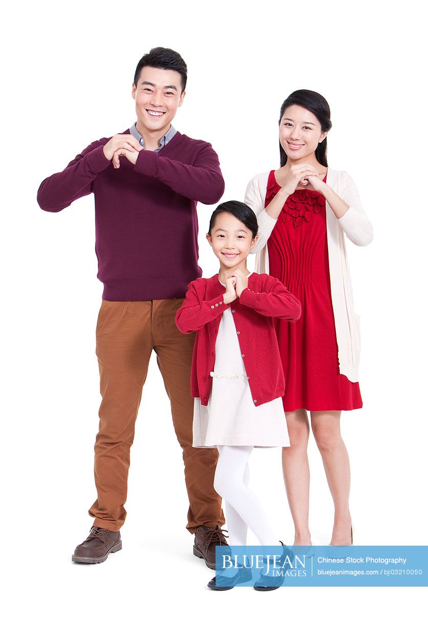 Cheerful family congratulating for Chinese New Year
