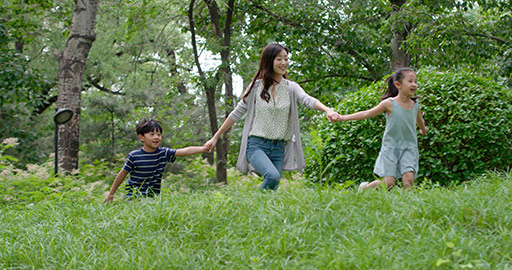 Happy Chinese family running on grass,4K