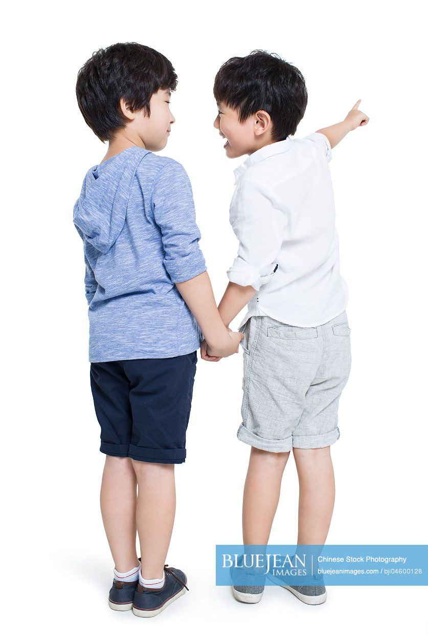 Happy Chinese boys pointing