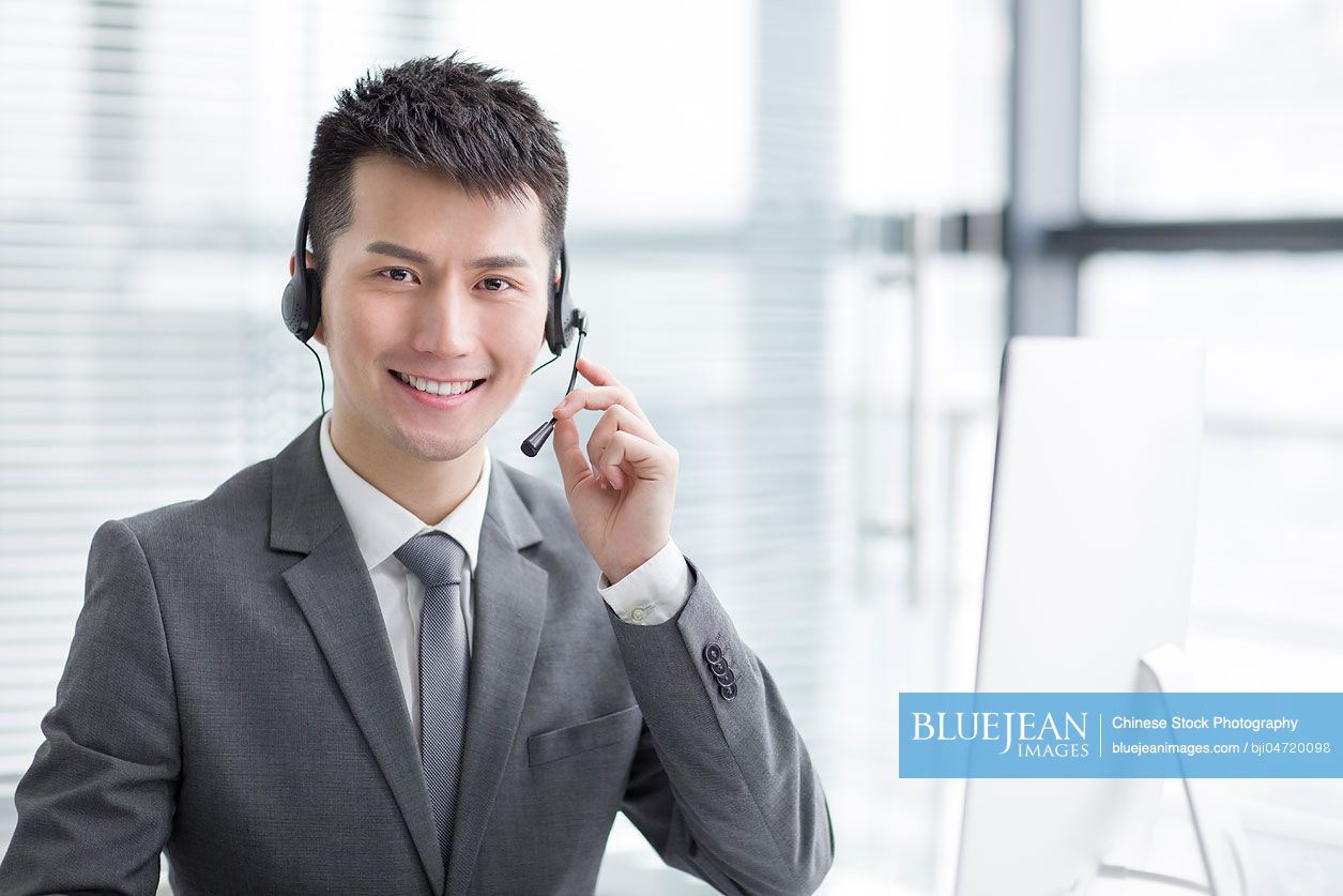 Portrait of Chinese businessman with headset
