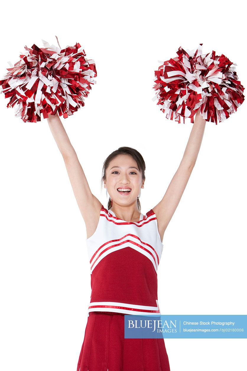 Chinese cheerleader in action with her pom-poms
