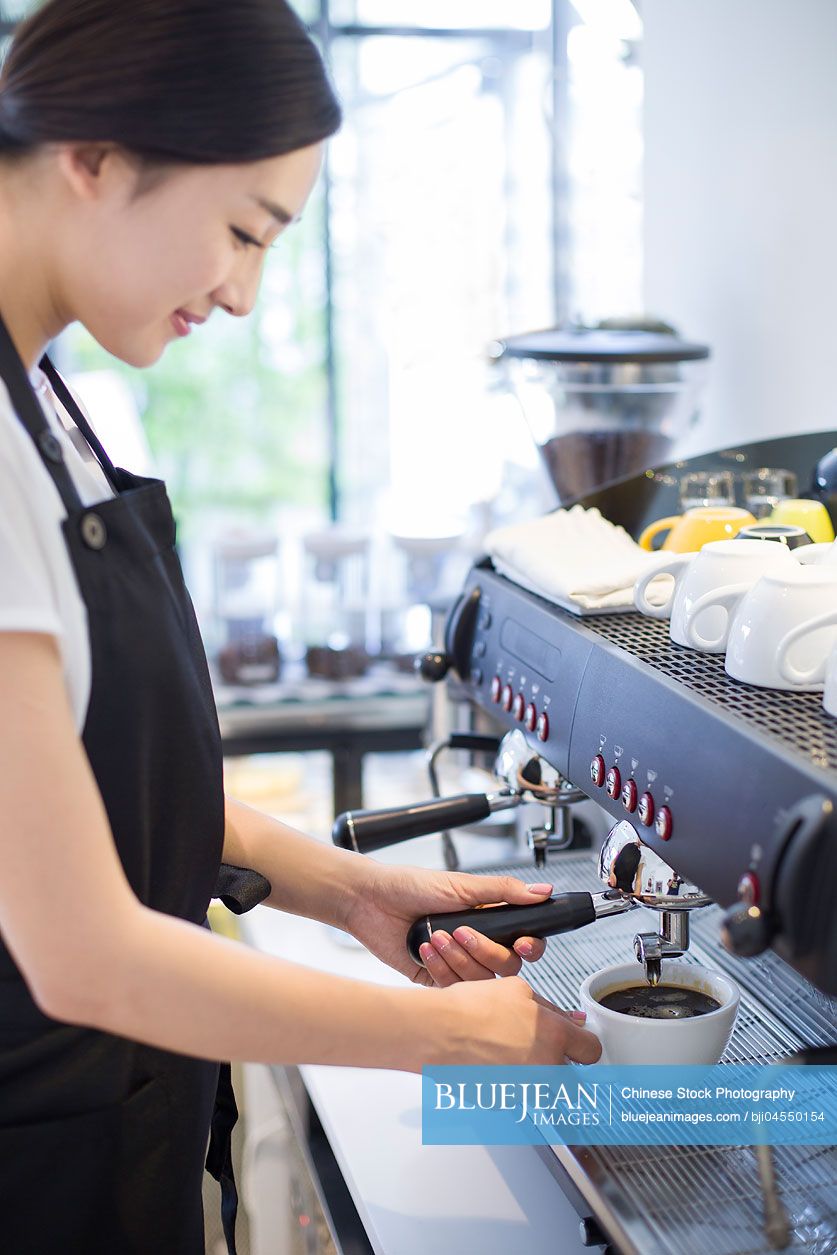 Chinese barista making coffee