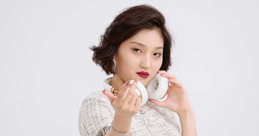 Fashionable young Chinese woman wearing headphones,4K