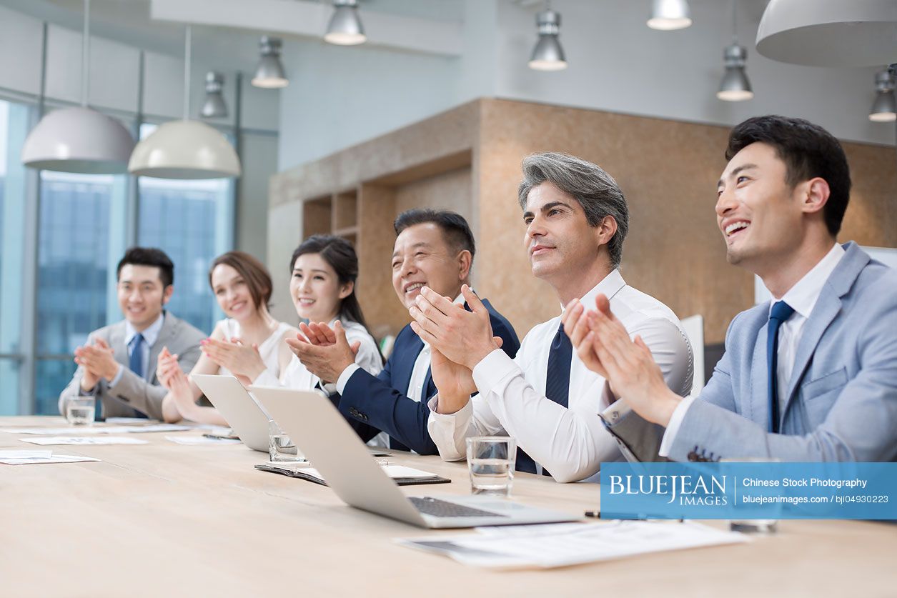 Business people having meeting in board room