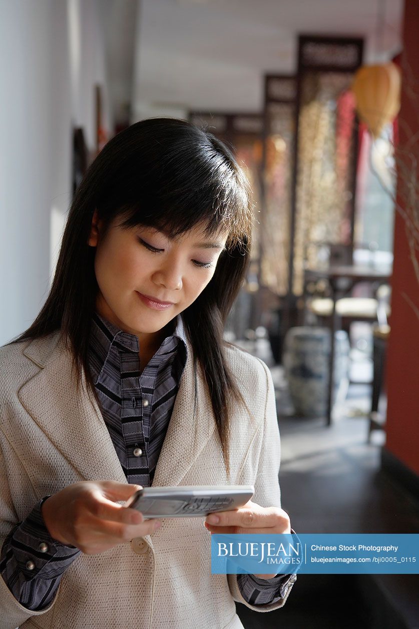 Chinese Woman Using Cell phone