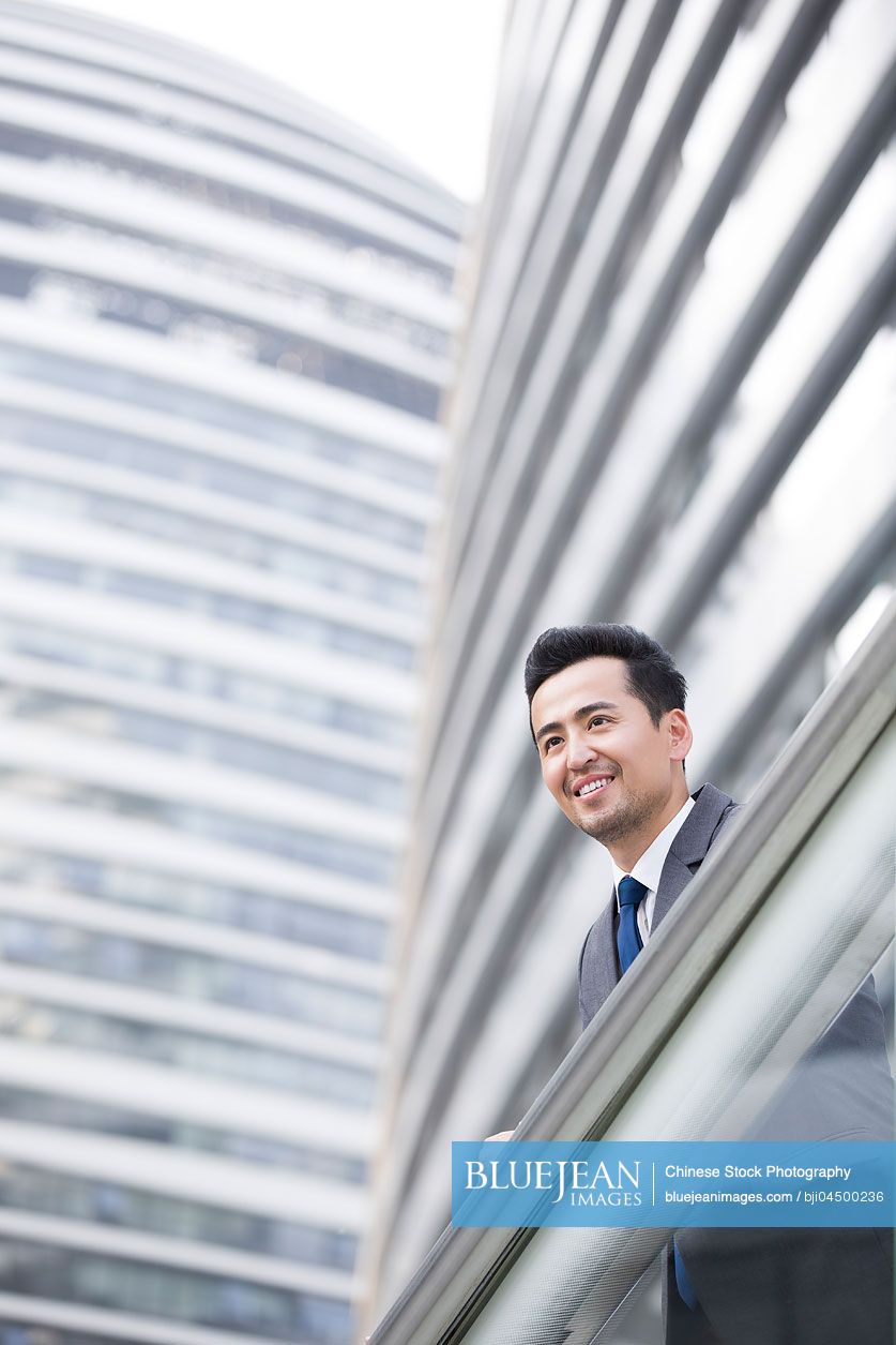 Chinese businessman looking at view thinking